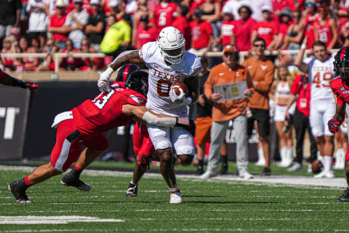 Sep 24, 2022; Lubbock, Texas, USA; Texas Longhorns tight end Ja'Tavion Sanders is tackled by Texas Tech Red Raiders linebacker Jacob Rodriguez (13) during a game at Jones AT&T Stadium.